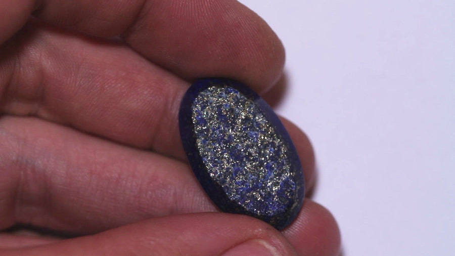 Lapis Lazuli. Rough face with many sparkling Golden Pyrite inclusions